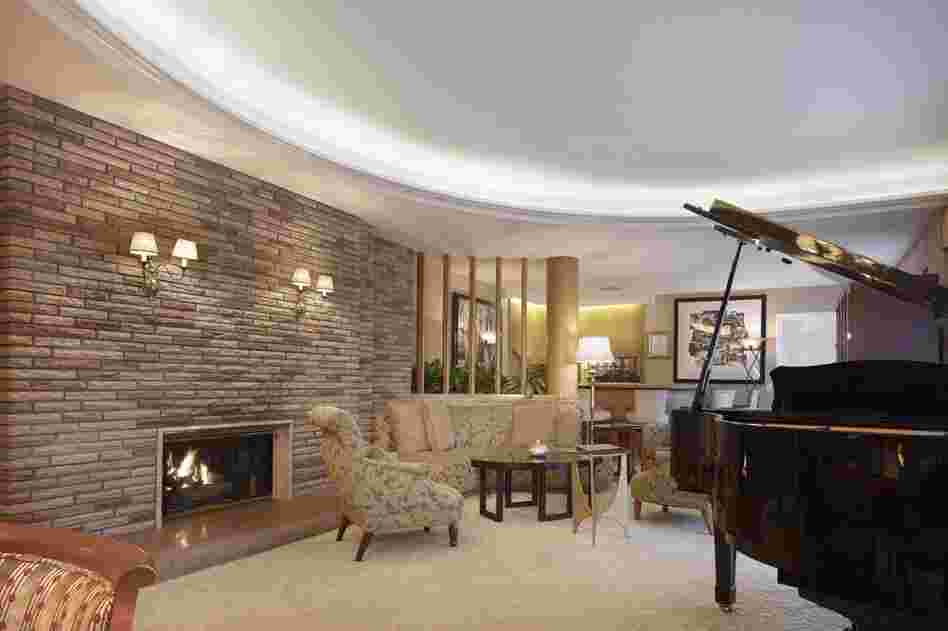 Another view of the Historic Paul Williams Suite. Originally designed in the late 1940s, the suite was moved to the second floor during a renovation in the 1990s, and re-created just as Williams designed it. It contains the same use of stone, curved walls and marble that are found in many of his permanent homes.