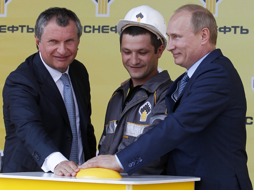 Russia's President Vladimir Putin (R) and CEO of state-controlled Russian oil company Rosneft Igor Sechin (L) push the button launching a new oil terminal at the Black Sea port of Tuapse on June 15. An expected fall in crude prices this autumn could have serious impacts on the economies of Russia and other nations reliant on oil exports.