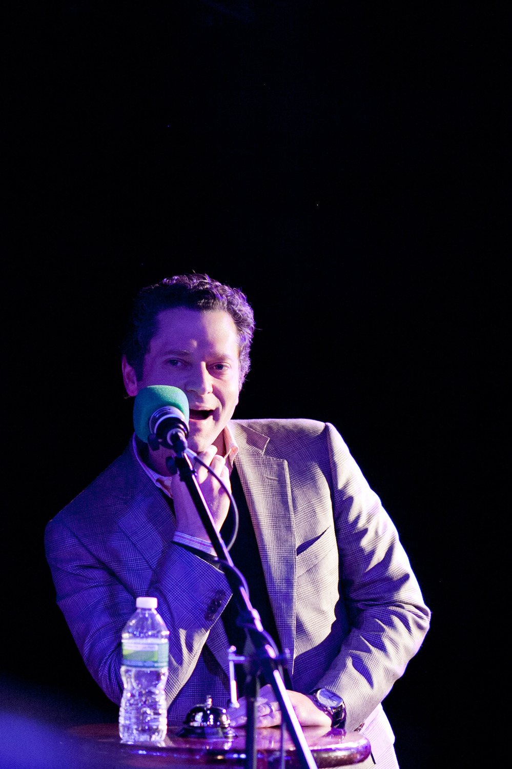 Sports journalist Jeremy Schaap in the hot seat on the Ask Me Another stage.