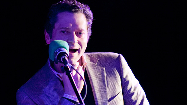 Sports journalist Jeremy Schaap in the hot seat on the Ask Me Another stage. (NPR)