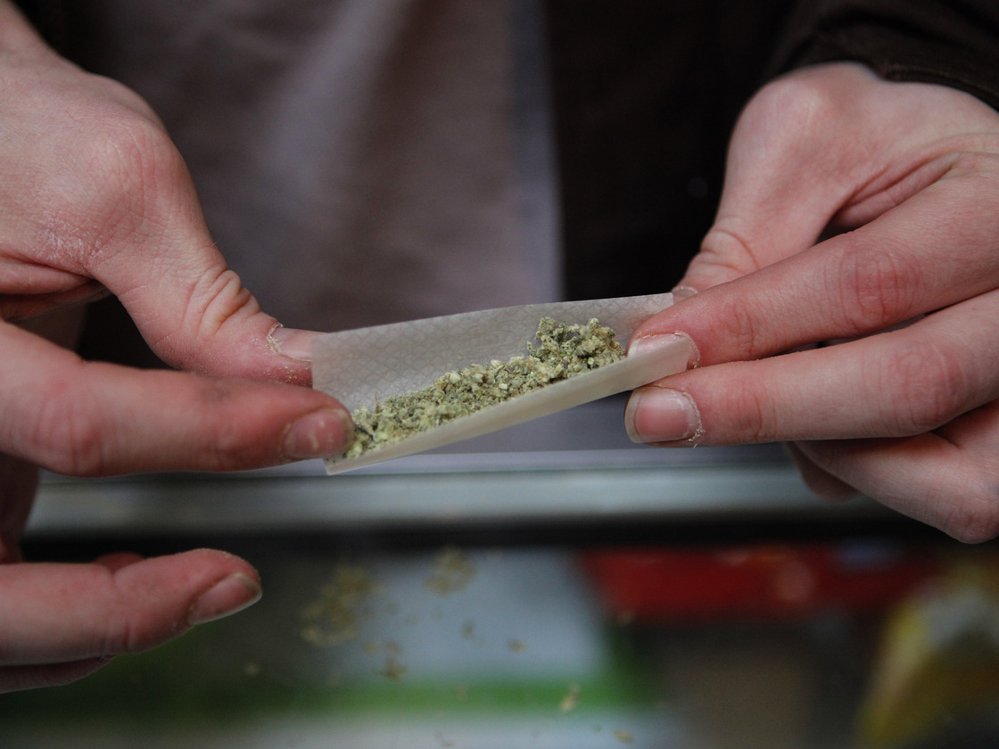Brian Lawson rolls a  marijuana cigarette at the BC Marijuana Party Headquarters in Vancouver, British Columbia. Vancouver is in the marijuana-friendly corner of Canada.