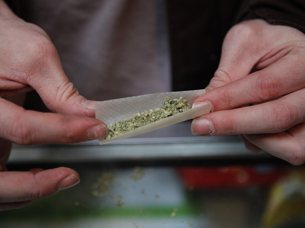 Brian Lawson rolls a  marijuana cigarette at the BC Marijuana Party Headquarters in Vancouver, British Columbia. Vancouver is in the marijuana-friendly corner of Canada.