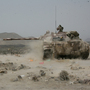 A Yemeni army tank fires at positions of al-Qaida militants near the coastal town of Shaqra, Yemen, last week, in a photo provided by Yemen's Defense Ministry. Yemen's army says it has pushed al-Qaida fighters out of towns in the south.
