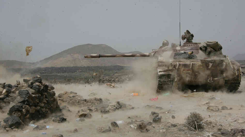 A Yemeni army tank fires at positions of al-Qaida militants near the coastal town of Shaqra, Yemen, last week, in a photo provided by Yemen's Defense Ministry. Yemen's army says it has pushed al-Qaida fighters out of towns in the south.
