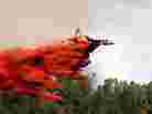 A plane drops fire retardant in LaPlata County, near Durango, Colo.