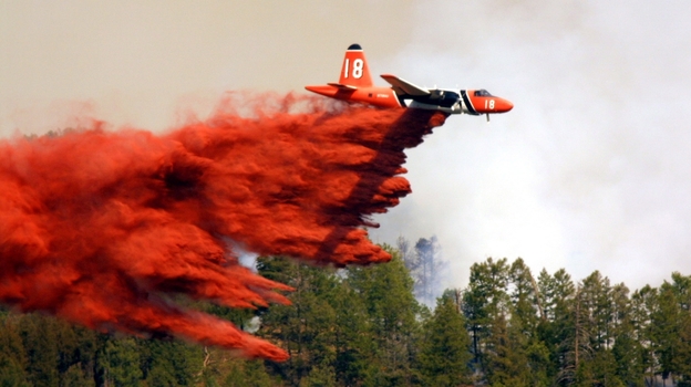 A plane drops fire retardant in LaPlata County, near Durango, Colo.