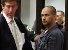 Defense attorney Mark O'Mara (left) with his client, George Zimmerman, at an April hearing related to second-degree murder charges in the killing of Trayvon Martin in Sanford, Fla.