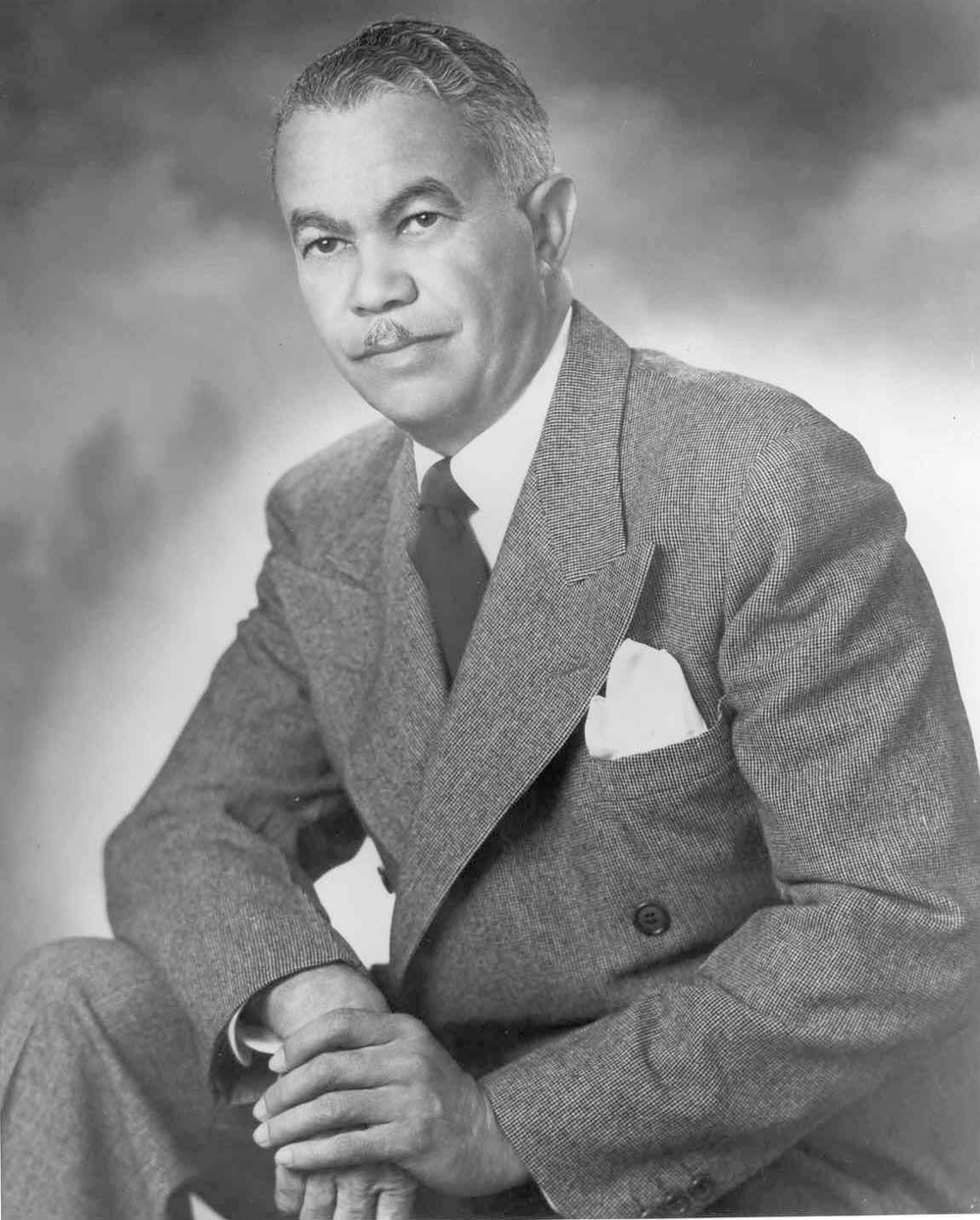 Architect Paul Williams (in a photo thought to be from the 1940s or '50s) developed the ability to sketch buildings upside down to accommodate white clients who might not want to sit next to him.
