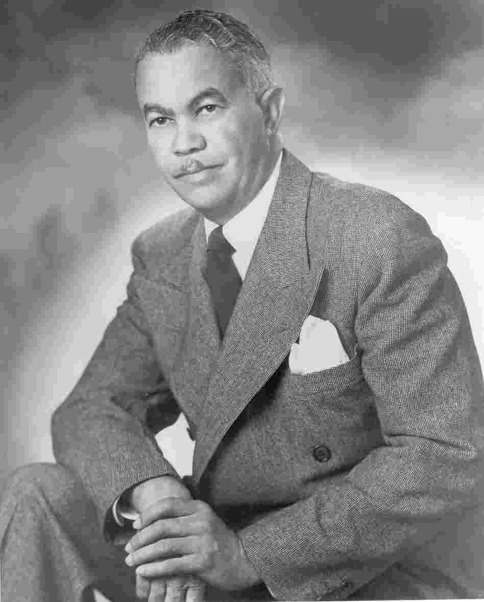 Architect Paul Williams (in a photo thought to be from the 1940s or '50s) developed the ability to sketch buildings upside down to accommodate white clients who might not want to sit next to him.