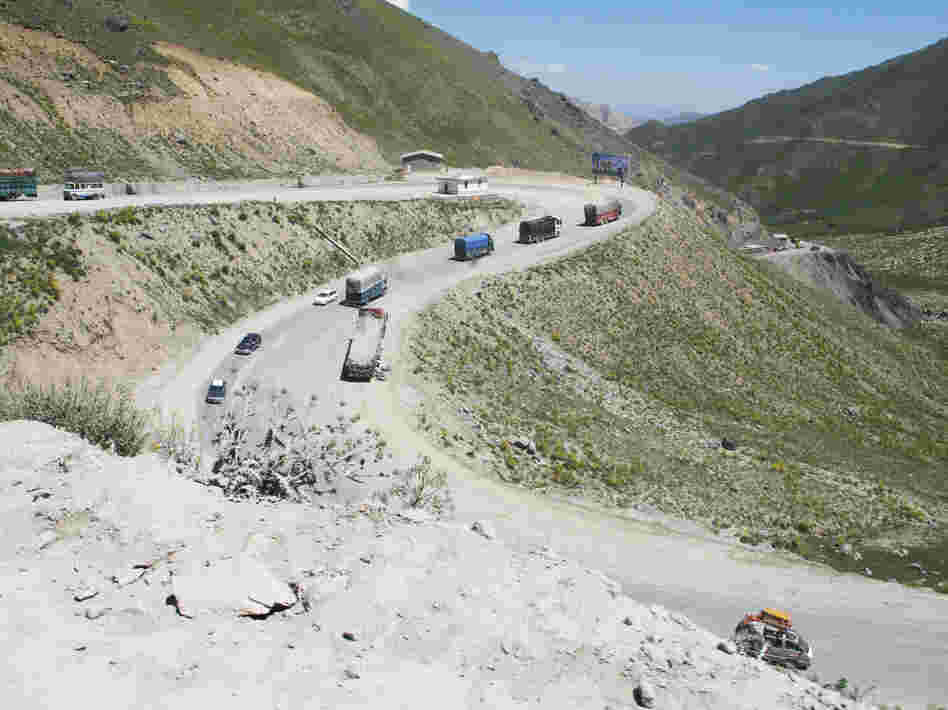 Vehicles drive one of the many switchbacks as the Salang Highway climbs from just over 5,000 feet at the valley floor to the Salang Tunnel, 11,000 feet up in the Hindu Kush range.