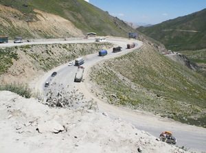 Vehicles drive one of the many switchbacks as the Salang Highway climbs from just over 5,000 feet at the valley floor to the Salang Tunnel, 11,000 feet up in the Hindu Kush range. Vehicles drive one of the many switchbacks as the Salang Highway climbs from just over 5,000 feet at the valley floor to the Salang Tunnel, 11,000 feet up in the Hindu Kush range.