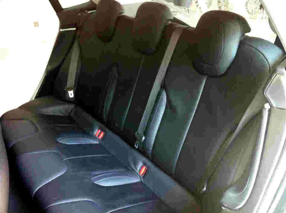 The sedan's rear seats go three wide. With the seats folded flat, the car offers some 66 cubic feet of storage, according to Tesla.