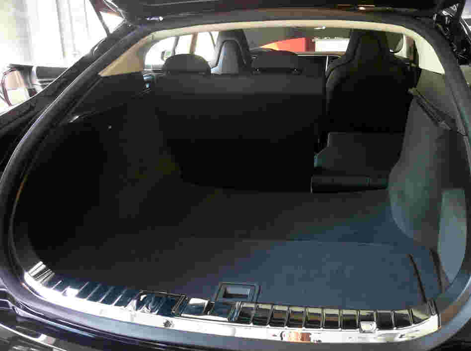 The rear trunk of the Model S sedan includes a removable panel (in foreground) that allows access to more storage.