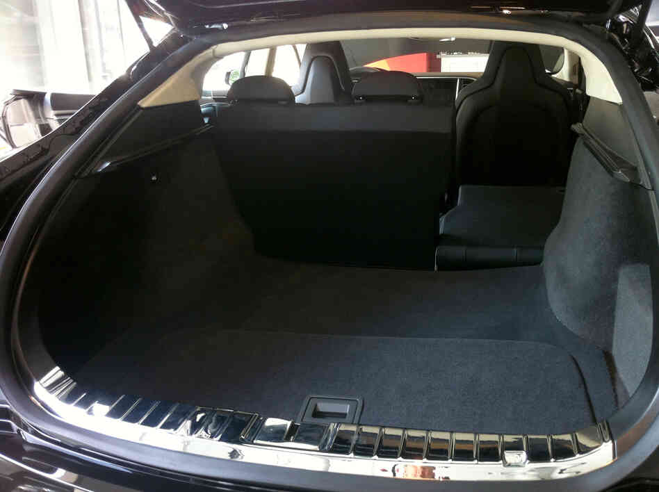 The rear trunk of the Model S sedan includes a removable panel (in foreground) that allows access to more storage.