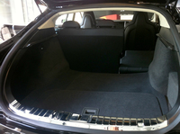 The rear trunk of the Model S sedan includes a removable panel (in foreground) that allows access to more storage.