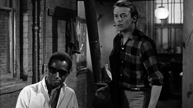 In The Connection, Leach (Warren Finnerty, right) and his friends wait around for their heroin fix, which eventually comes courtesy of Cowboy (Carl Lee). The controversial film was shut down in New York after two screenings in 1962.