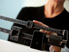 A woman checks her weight at the doctor's office. A woman checks her weight at the doctor's office.