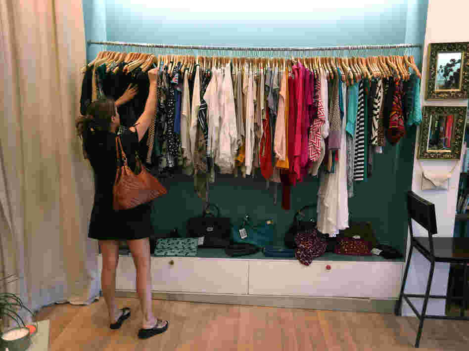 Vanessa Loren shops in Miami. An index of consumer sentiment dropped more than expected in June.