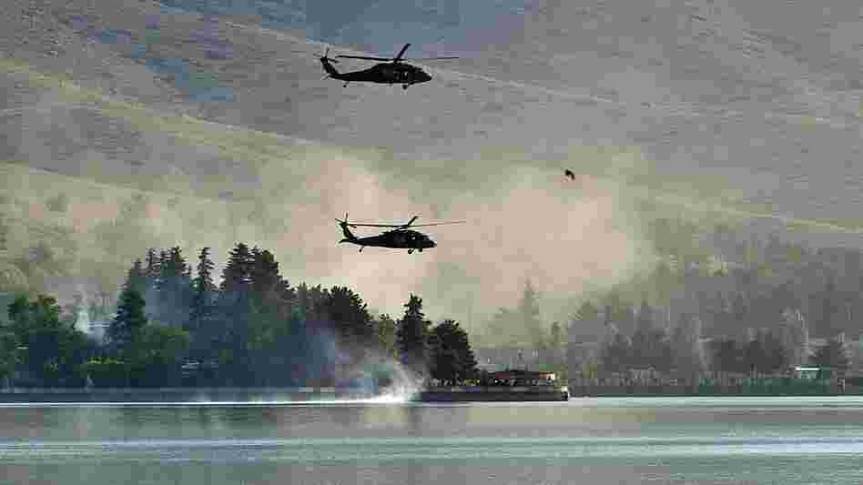 Responding to a Taliban attack, NATO Black Hawk helicopters fly over the Spozhmai Hotel on Lake Qargha outside Kabul. More than 20 people were killed before the Taliban fighters were shot dead. Responding to a Taliban attack, NATO Black Hawk helicopters fly over the Spozhmai Hotel on Lake Qargha outside Kabul. More than 20 people were killed before the Taliban fighters were shot dead.