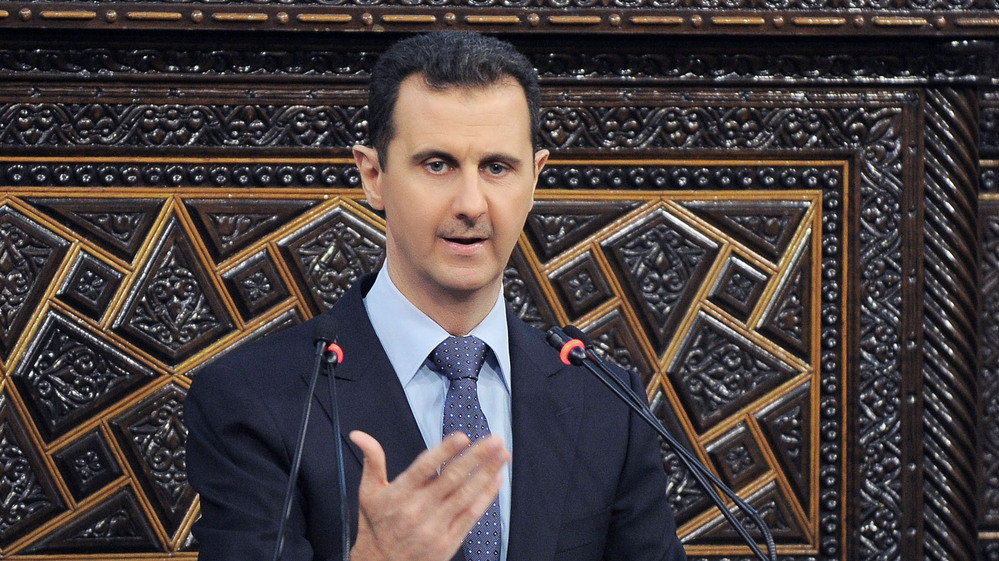 President Bashar Assad addresses Parliament on June 3. Syrians in the capital, Damascus, have become more willing to speak out, though they still don't want to be identified by name. Many feel the Assad regime is losing control of parts of the country.