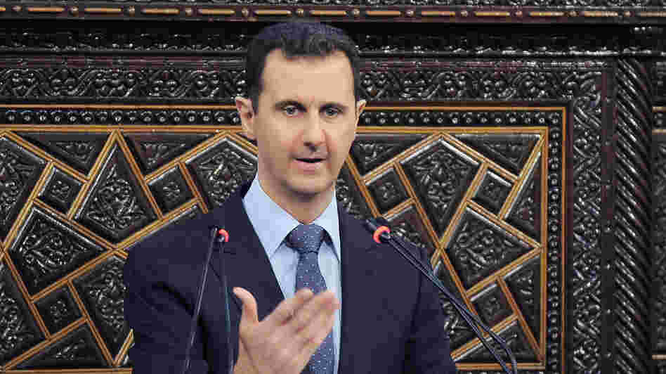 President Bashar Assad addresses Parliament on June 3. Syrians in the capital, Damascus, have become more willing to speak out, though they still don't want to be identified by name. Many feel the Assad regime is losing control of parts of the country.