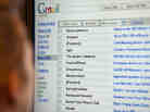A woman looks through her email.