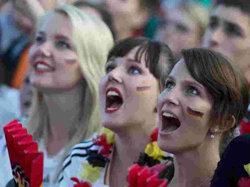 German soccer fans in Berlin cheer on their team June 17 at a public screening of the game against Denmark, which Germany won, 2-1.