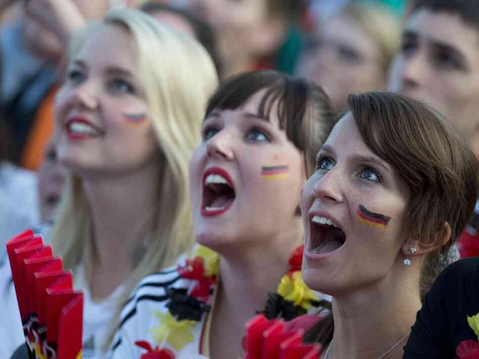German soccer fans in Berlin cheer on their team June 17 at a public screening of the game against Denmark, which Germany won, 2-1.
