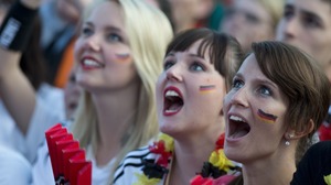 German soccer fans in Berlin cheer on their team June 17 at a public screening of the game against Denmark, which Germany won, 2-1.