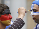 An artist with the German national colors on his face paints the Greek colors on a soccer fan in Gdansk, Poland, on Friday as Germany and Greece prepared to play in the quarterfinals of the Euro 2012 soccer championship. An artist with the German national colors on his face paints the Greek colors on a soccer fan in Gdansk, Poland, on Friday as Germany and Greece prepared to play in the quarterfinals of the Euro 2012 soccer championship.