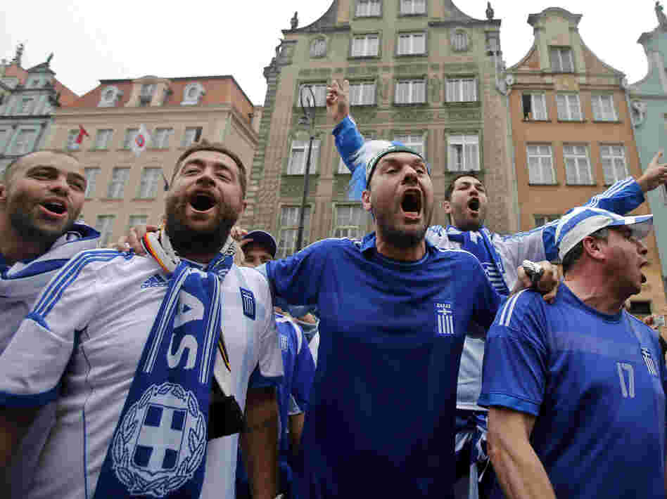 Greek fans shout slogans before Friday's soccer match between Greece and Germany in Gdansk, Poland.
