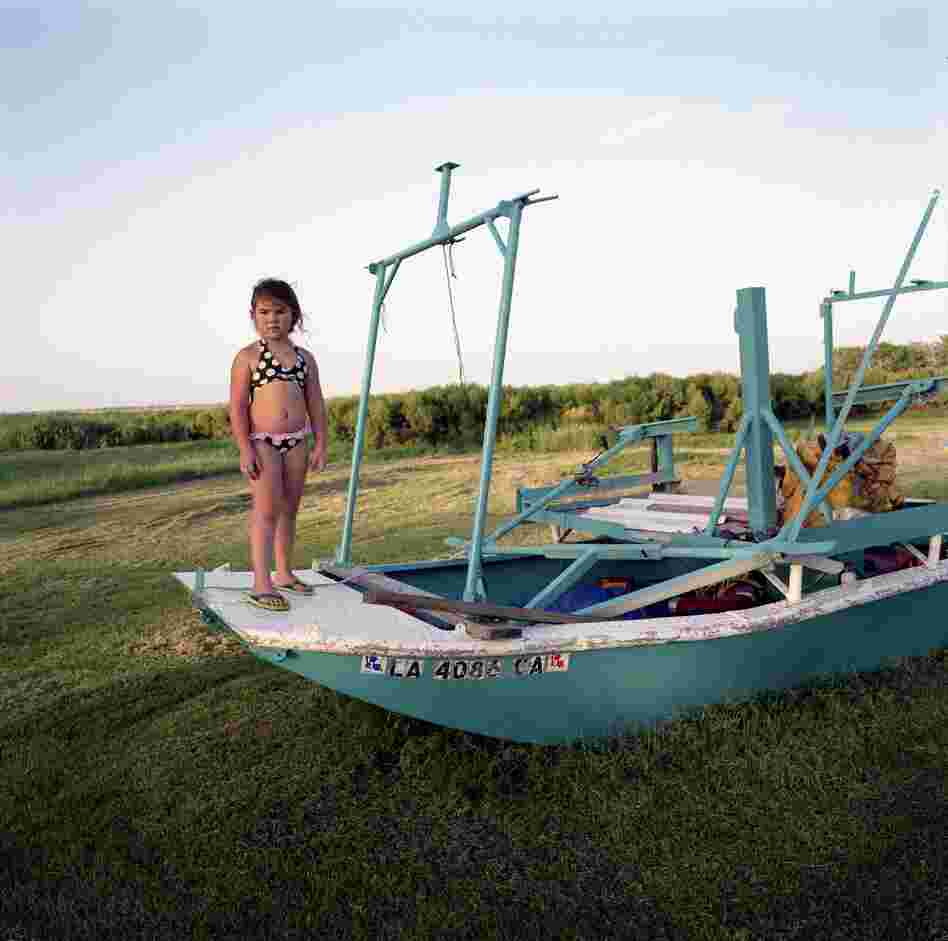 Kierstin Guidry with Hilton Chaisson's Boat, Isle de Jean Charles, Louisiana, 2010