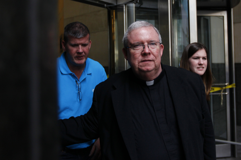 Monsignor William Lynn exits the Criminal Justice Center on Tuesday in Philadelphia.