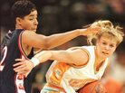 Michelle Marciniak (right) of the University of Tennessee Lady Volunteers attempts to elude the defensive pressure of Nykesha Sales of the UConn Huskies during the 1996 NCAA Women's Final Four. Michelle Marciniak (right) of the University of Tennessee Lady Volunteers attempts to elude the defensive pressure of Nykesha Sales of the UConn Huskies during the 1996 NCAA Women's Final Four.