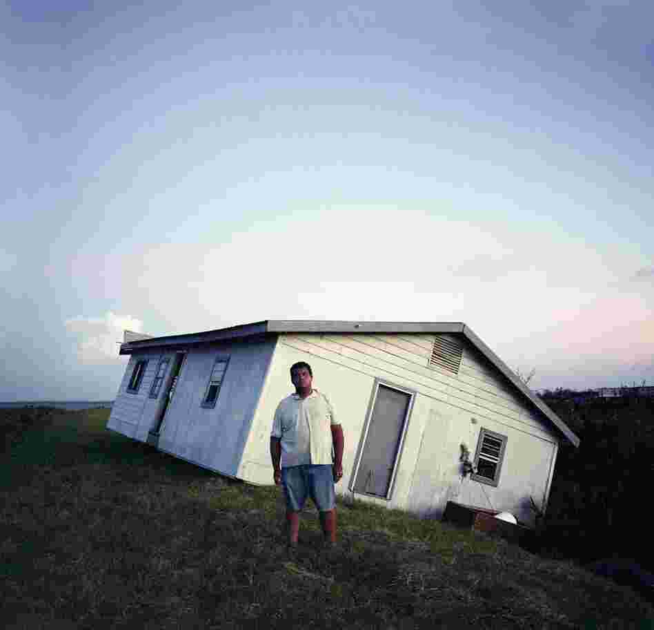 Walter Dardar Jr., with His Father's House after Hurricanes Gustav and Ike, Isle de Jean Charles, Louisiana, 2008