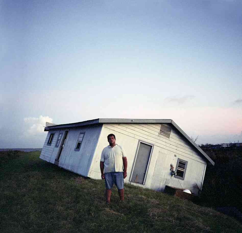 Walter Dardar Jr., with His Father's House after Hurricanes Gustav and Ike, Isle de Jean Charles, Louisiana, 2008