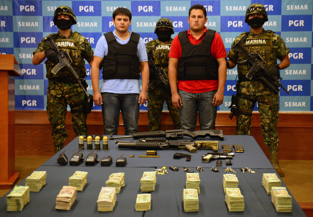 On Thursday, the Mexican Navy presented Felix Beltran Leon (in red) as the son of Joaquin "El Chapo" Guzman, Jesus Alfredo Guzman Salazar. On Friday, Mexican and U.S. officials confirmed that Beltran's identity had been mistaken.