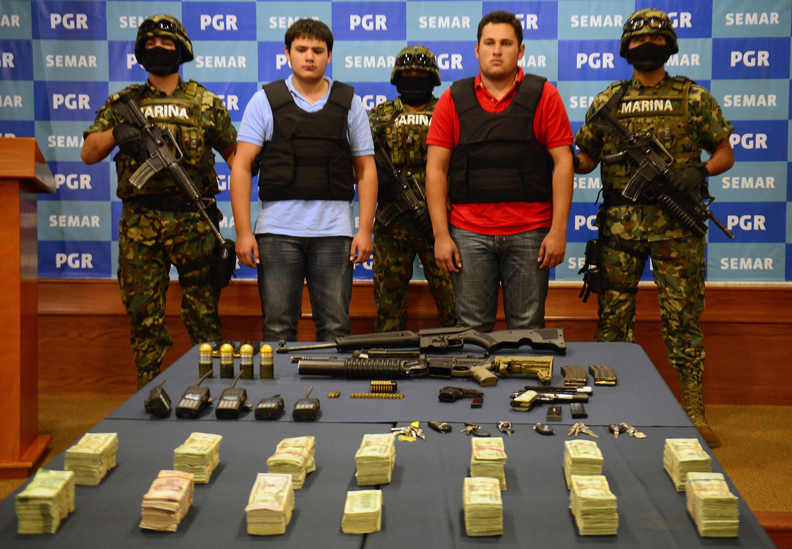 On Thursday, the Mexican Navy presented Felix Beltran Leon (in red) as the son of Joaquin "El Chapo" Guzman, Jesus Alfredo Guzman Salazar. On Friday, Mexican and U.S. officials confirmed that Beltran's identity had been mistaken.