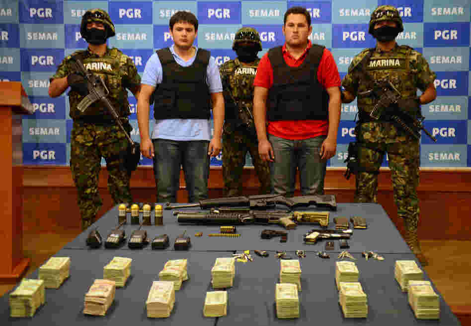 On Thursday, the Mexican Navy presented Felix Beltran Leon (in red) as the son of Joaquin "El Chapo" Guzman, Jesus Alfredo Guzman Salazar. On Friday, Mexican and U.S. officials confirmed that Beltran's identity had been mistaken.