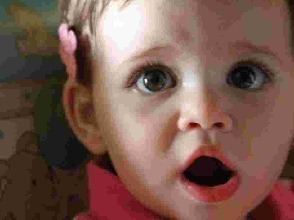 Human baby Charlotte, the 13-month-old daughter of NPR producer Tom Bullock, tried the same tests that DeeChee, the robot, does for language-learning experiments. Dr. Caroline Lyons says human babies have an advantage: They spend every waking hour of the day in a speaking world.
