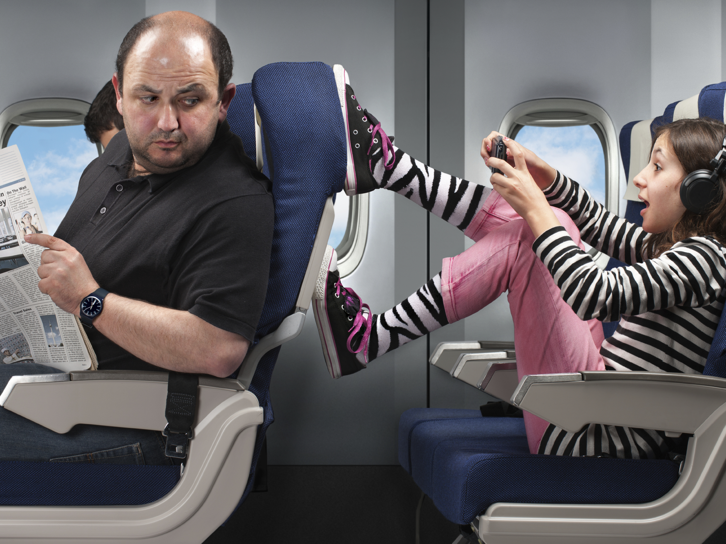 Some parents say the hardest part of flying with young kids on an airplane is dealing with unpredictable kids and adult passengers. (Image credit: iStockphoto.com)