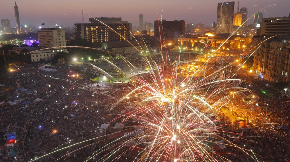 Fireworks illuminate Tahrir Square in Cairo, Egypt, on Sunday to celebrate the victory of Mohammed Morsi in the country's presidential election.