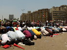 Egyptian supporters of their new president-elect, Muslim Brotherhood leader Mohamed Morsi, perform noon prayers in Cairo's Tahrir Square, one day after Morsi was elected as the country's "first civilian president" on Sunday. Egyptian supporters of their new president-elect, Muslim Brotherhood leader Mohamed Morsi, perform noon prayers in Cairo's Tahrir Square, one day after Morsi was elected as the country's "first civilian president" on Sunday.