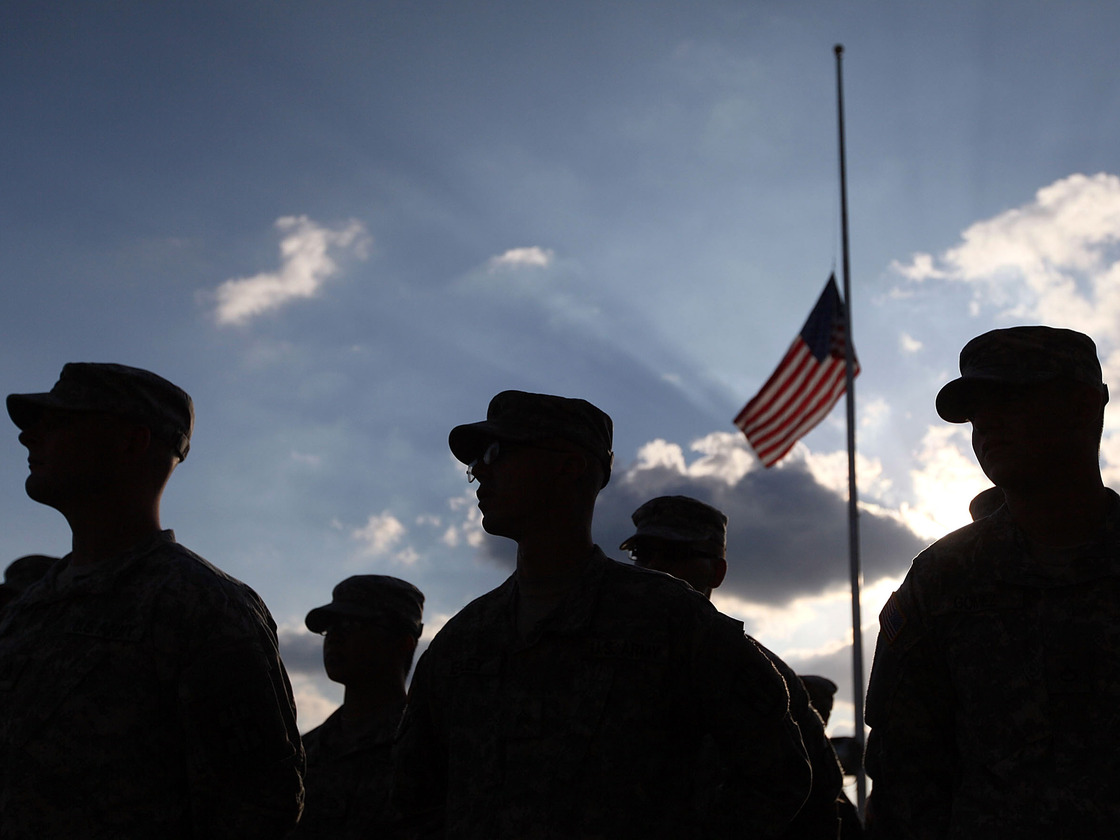 U.S. Army soldiers attend a Nov. 10, 2010, service for the 13 people killed in the shooting rampage five days earlier at Fort Hood.