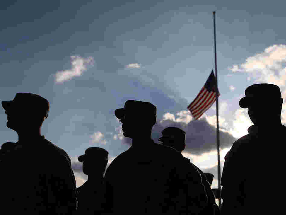U.S. Army soldiers attend a Nov. 10, 2010, service for the 13 people killed in the shooting rampage five days earlier at Fort Hood.