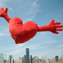Red heart cushion with arms flies over city skyline with arms wide open for a big hug. Red heart cushion with arms flies over city skyline with arms wide open for a big hug.