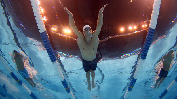 Michael Phelps swims in a preliminary heat at the 2012 U.S. Olympic Trials in Omaha, Nebraska. Phelps and rival Ryan Lochte were awoken from their afternoon naps by a fire alarm at their hotel Monday.