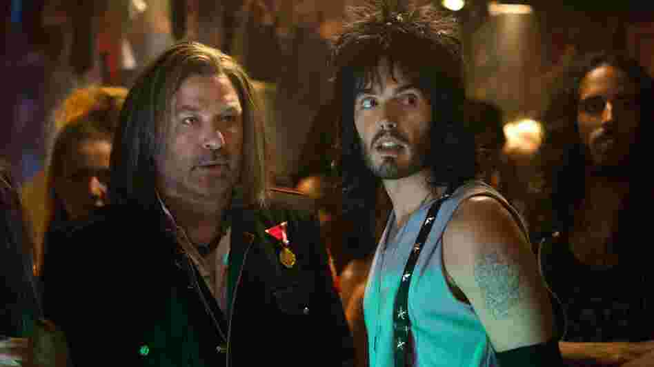 Club owner Dennis Dupree (Alec Baldwin, left) and his assistant Lonny Barnett (Russell Brand) try to figure out a way to keep their nightclub open in the movie adaptation of Rock of Ages. Club owner Dennis Dupree (Alec Baldwin, left) and his assistant Lonny Barnett (Russell Brand) try to figure out a way to keep their nightclub open in the movie adaptation of Rock of Ages.