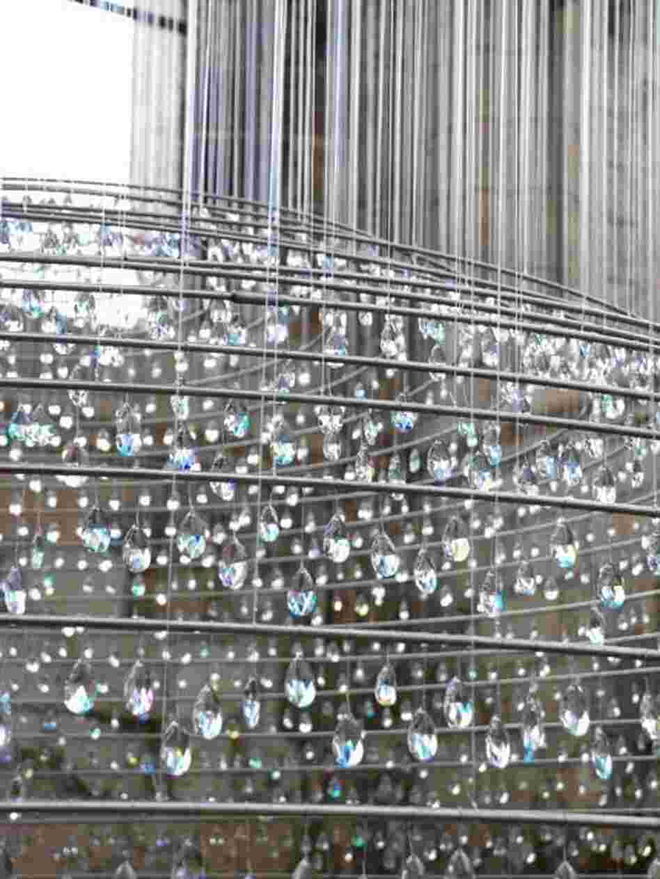 According to the artists' website, the crystals that hang in the tower are meant to serve as symbols of the soul's purification by ascension to heaven.