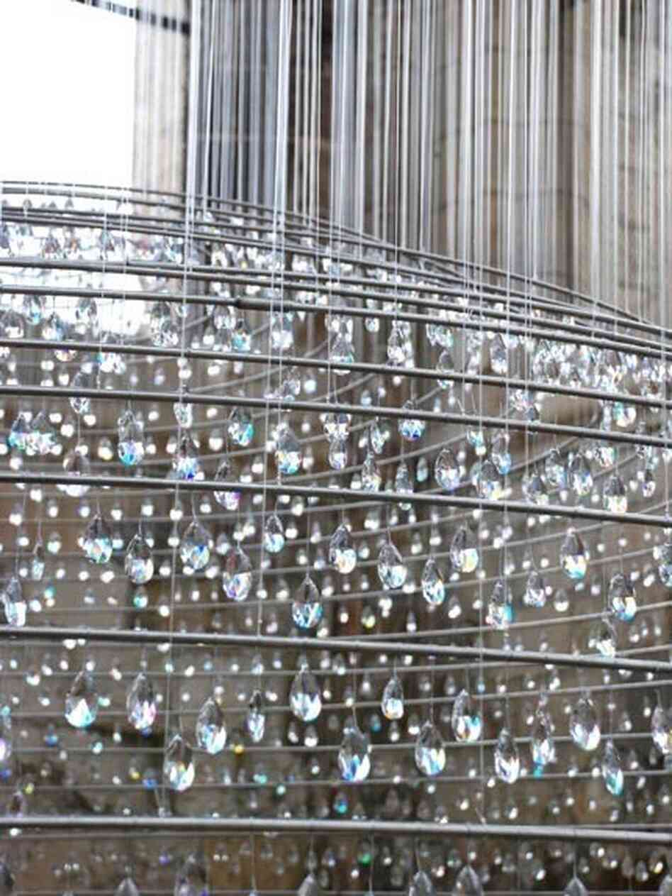 According to the artists' website, the crystals that hang in the tower are meant to serve as symbols of the soul's purification by ascension to heaven.